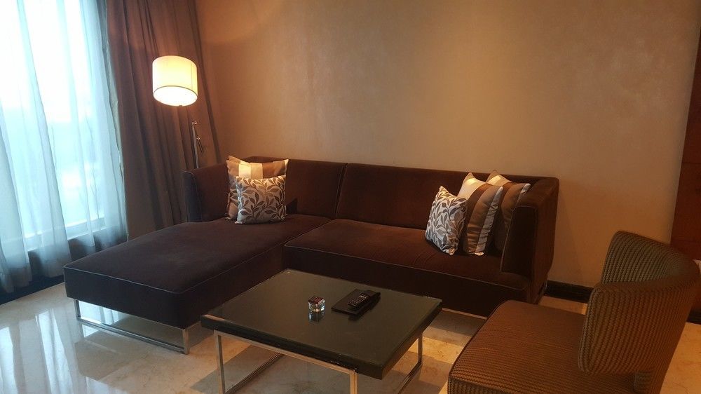 Vivanta Hyderabad, Begumpet Kültér fotó A living room in a suite at the Ritz-Carlton, Kuala Lumpur